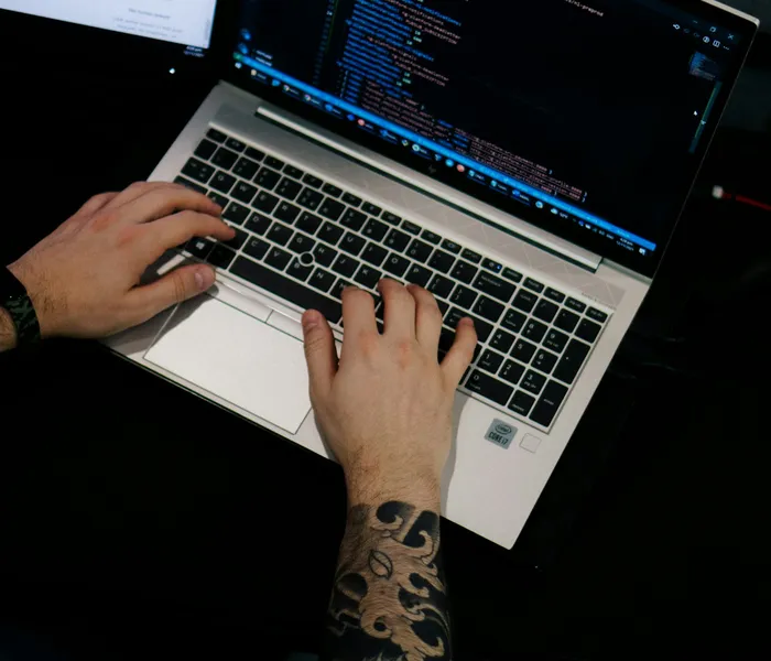 Infrastructure-as-code configuration open in an editor, with a CI pipeline passing on a second screen